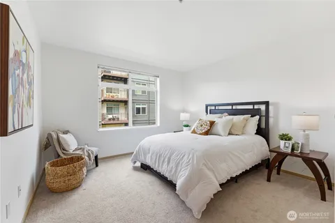a bedroom with bed and a window