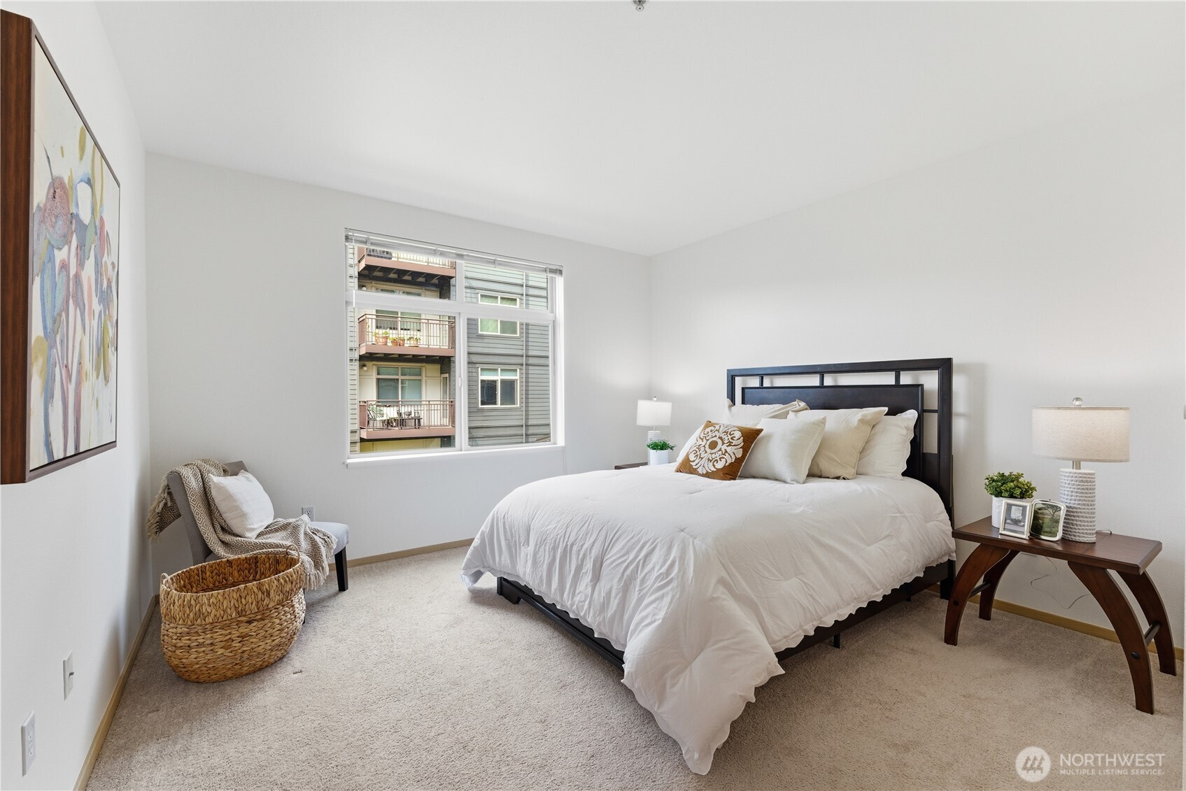 3333 Wallingford Avenue North, Unit 203 Seattle, WA 98103 - Photo 23 of 37 a bedroom with bed and a window
