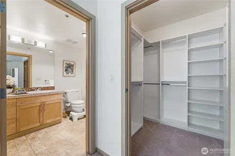 a room with a bed and a view of bathroom