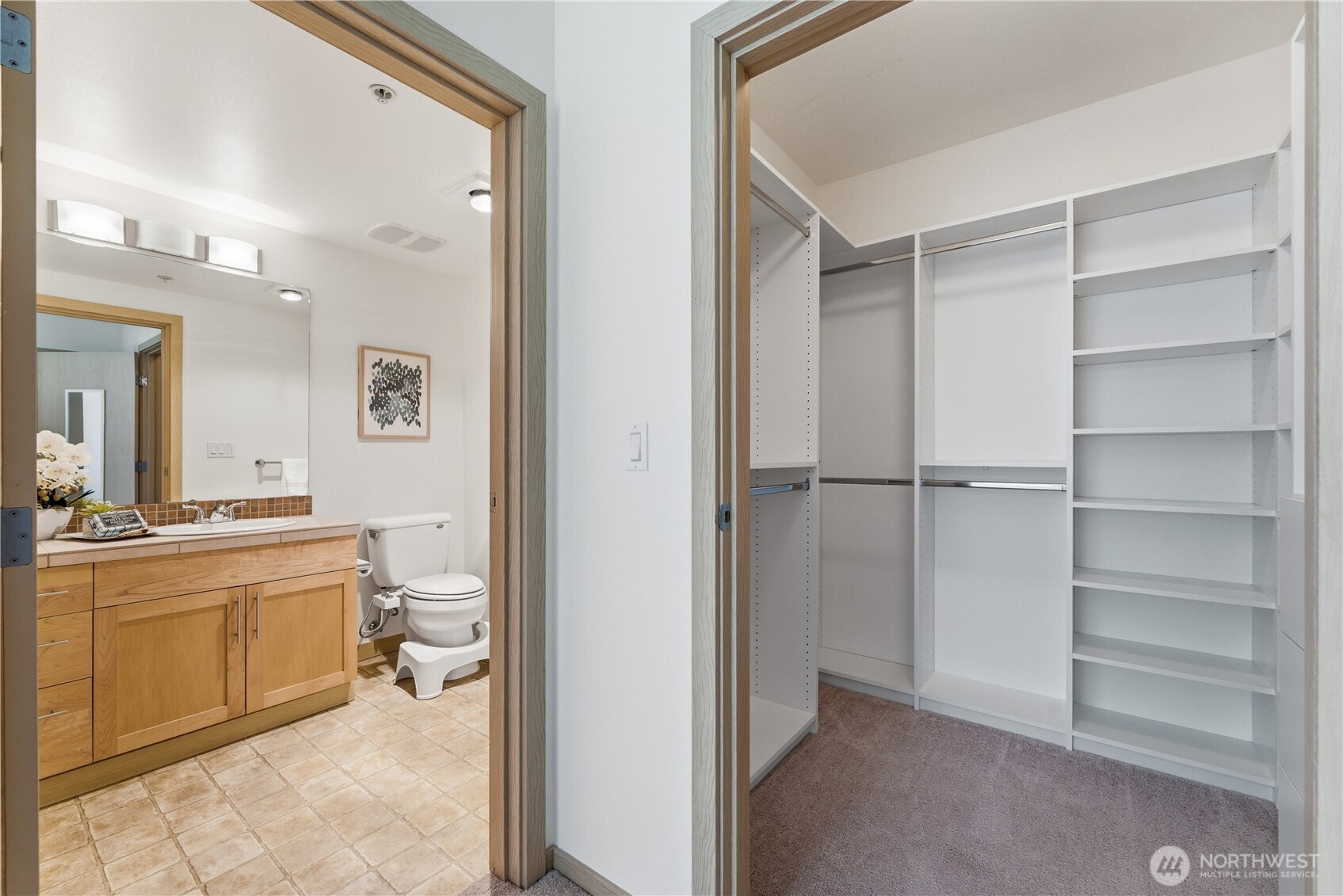 3333 Wallingford Avenue North, Unit 203 Seattle, WA 98103 - Photo 26 of 37 a room with a bed and a view of bathroom