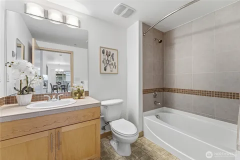 a bathroom with a sink a toilet and a bathtub