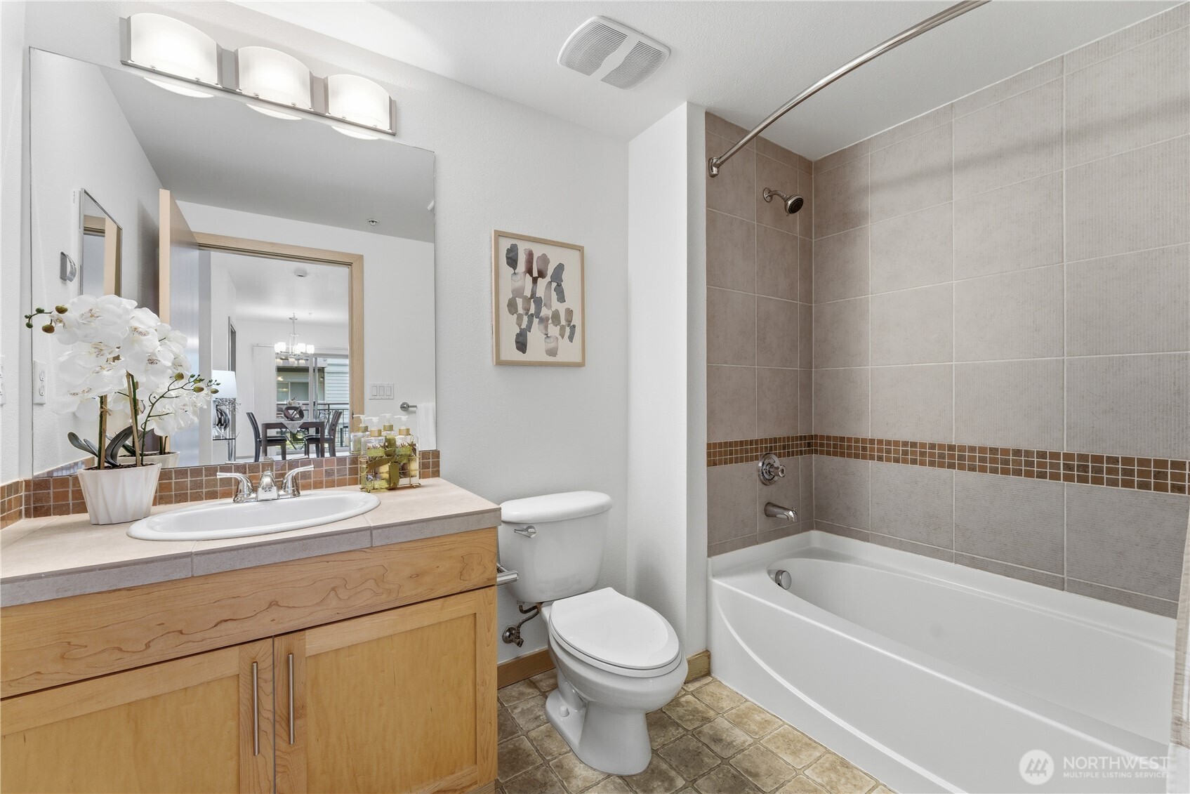 3333 Wallingford Avenue North, Unit 203 Seattle, WA 98103 - Photo 28 of 37 a bathroom with a sink a toilet and a bathtub