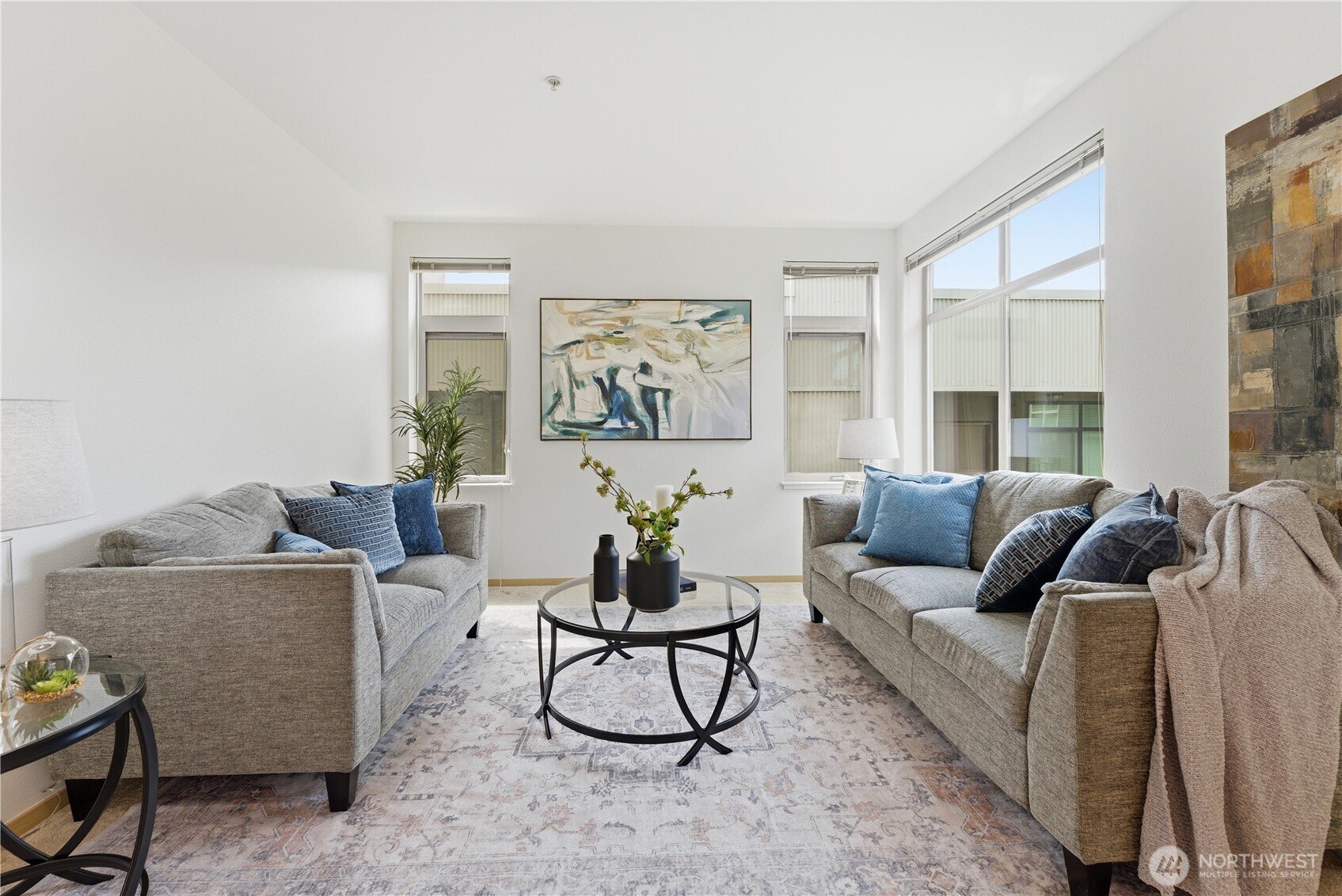 3333 Wallingford Avenue North, Unit 203 Seattle, WA 98103 - Photo 6 of 37 a living room with furniture and a large window