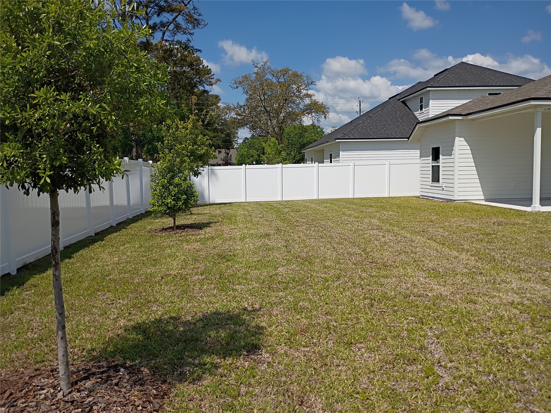 96052 Pirates Bluff Road Yulee, FL 32097 - Photo 4 of 22 a view of an outdoor space and a yard