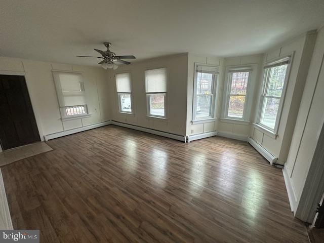 519 Twin County Road Honey Brook, PA 19344 - Photo 11 of 14 a view of an empty room with wooden floor and a window
