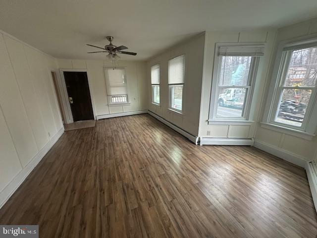 519 Twin County Road Honey Brook, PA 19344 - Photo 10 of 14 an empty room with wooden floor and windows
