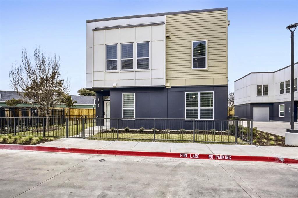 10715 Garland Road, Unit 5001 Dallas, TX 75218 - Photo 2 of 11 a view of front of a house with a yard