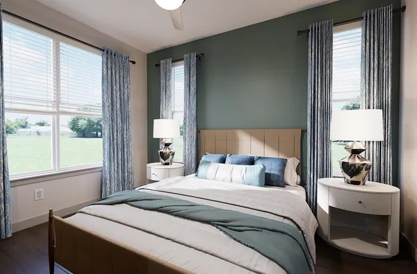 a bedroom with a bed and a large window