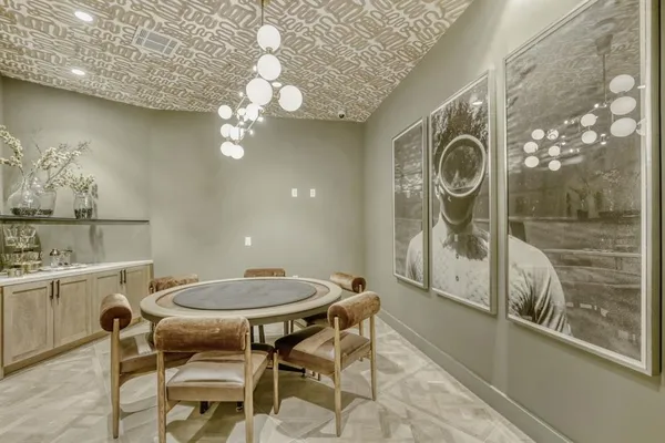 a dining room with a table and chairs