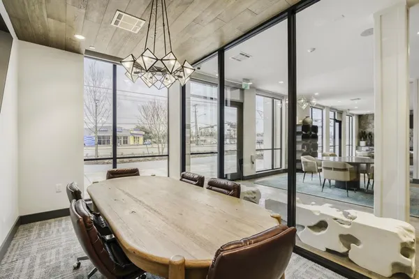 a dining room with large window