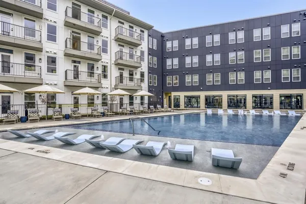 a front view of a building with swimming pool
