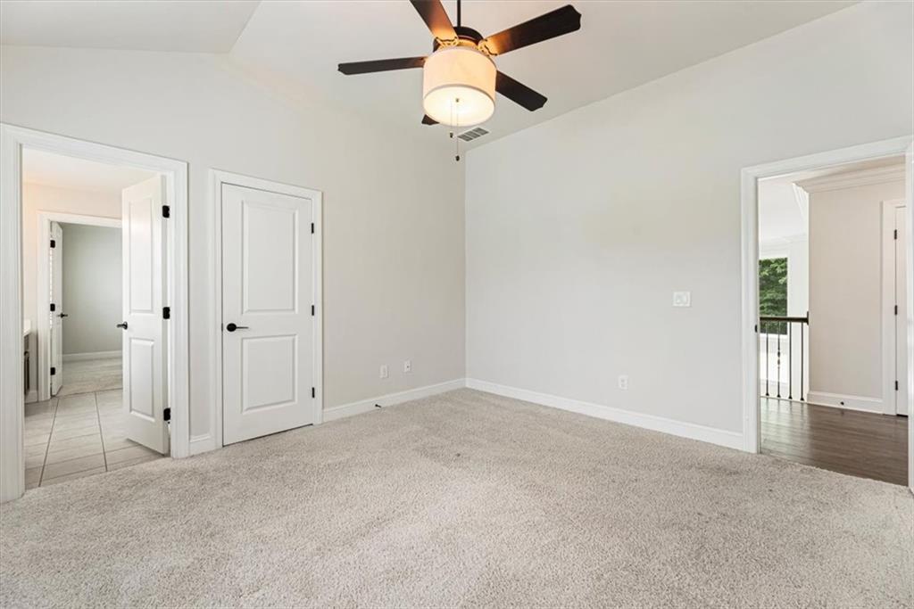947 Hunter Way Milton, GA 30004 - Photo 61 of 78 an empty room with fan and entrance