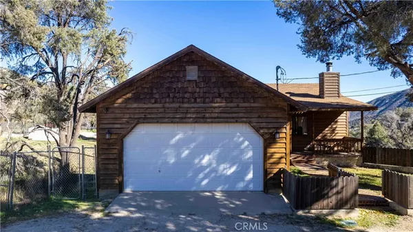 a front view of a house with yard