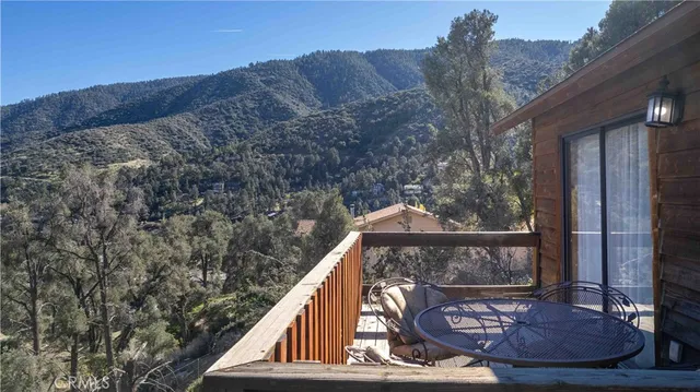 a view of a street with houses on both side