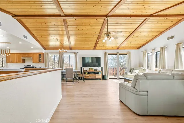 a dining room with furniture and wooden floor