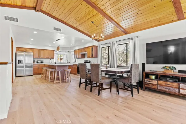 a view of an entryway with wooden floor and a livingroom
