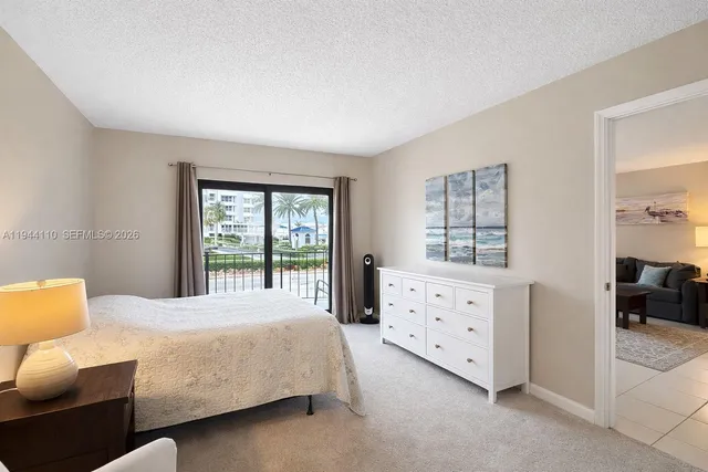 a bedroom with bed and window