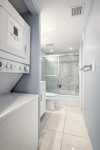 a bathroom with a bathtub sink and toilet