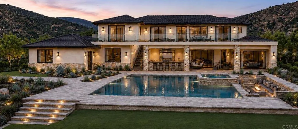 18406 Via Ambiente Rancho Santa Fe, CA 92067 - Photo 2 of 12 a front view of a house with garden