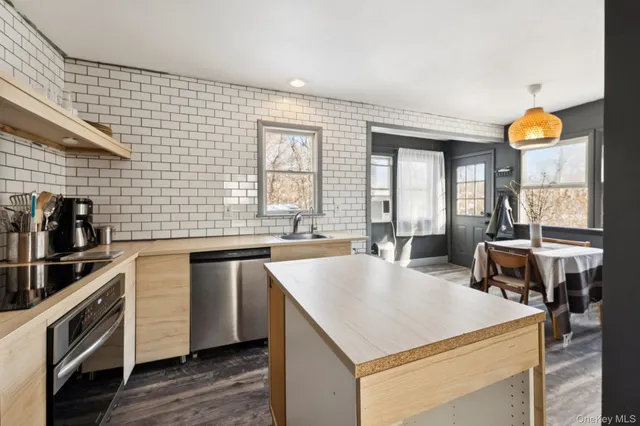 a kitchen with a stove a refrigerator and a stove