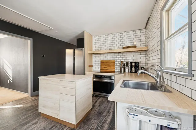 a kitchen with a sink and cabinets