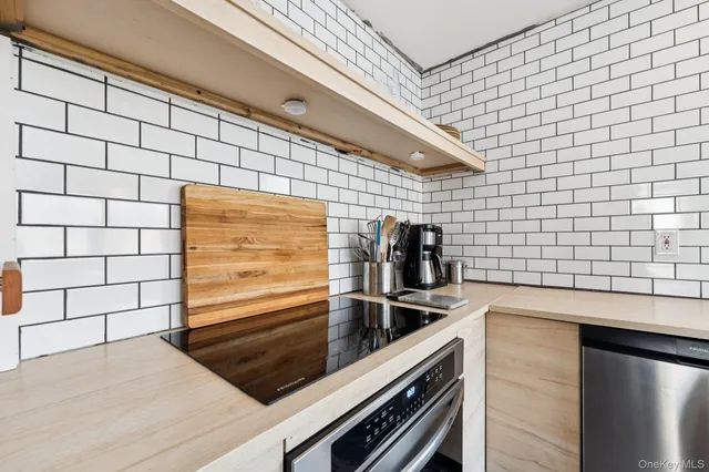 a kitchen with a sink and a refrigerator