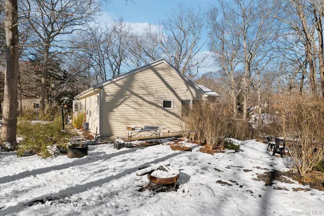 a view of a house with a snow on the road