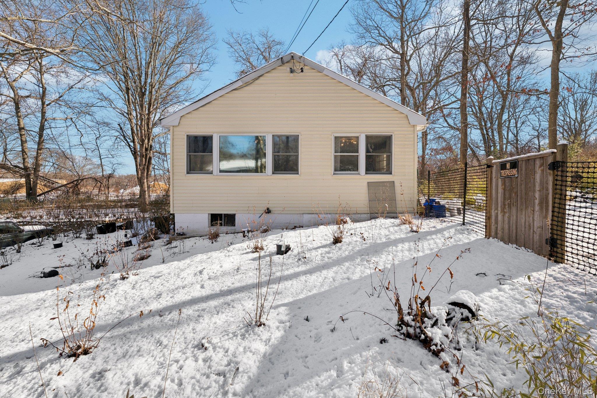 176 Maple Avenue South Flanders, NY 11901 - Photo 37 of 40 a view of a house with a snow on the road
