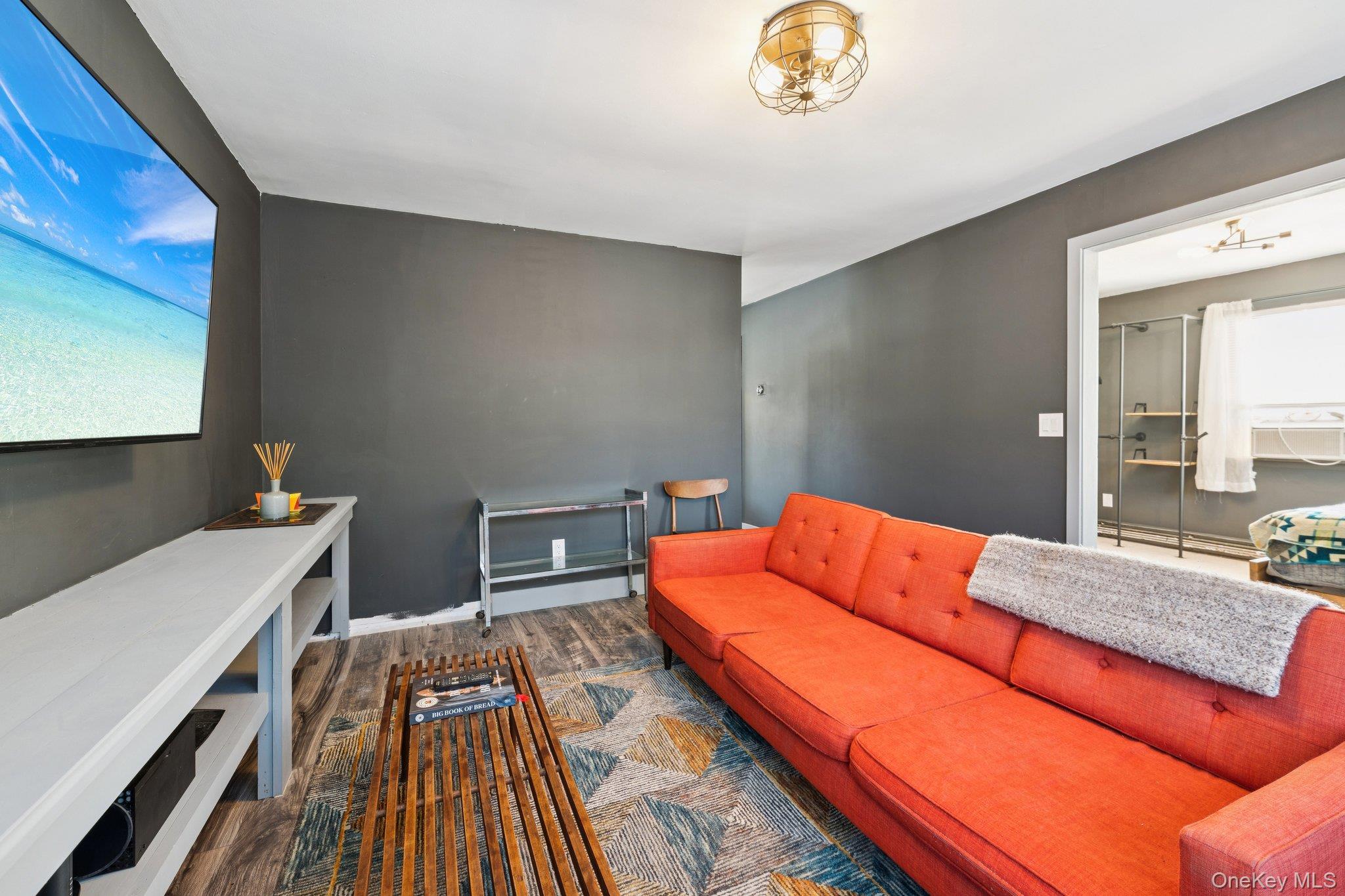 176 Maple Avenue South Flanders, NY 11901 - Photo 4 of 40 a blue bed sitting in a bedroom next to a window