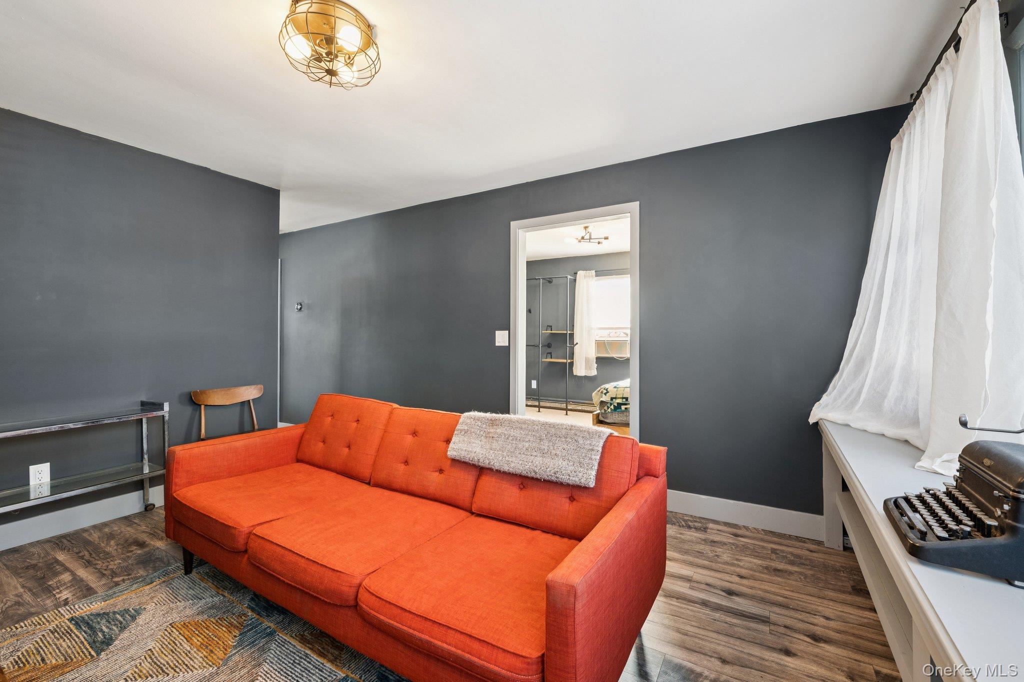 176 Maple Avenue South Flanders, NY 11901 - Photo 5 of 40 a blue bed sitting in a bedroom next to a window