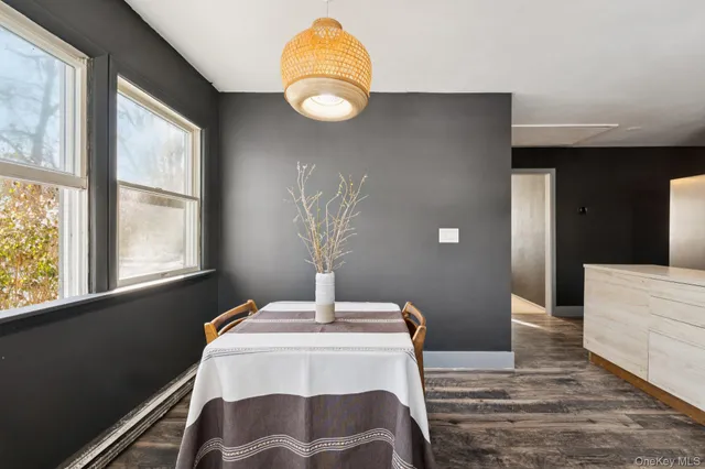 a kitchen with a table and chairs in it