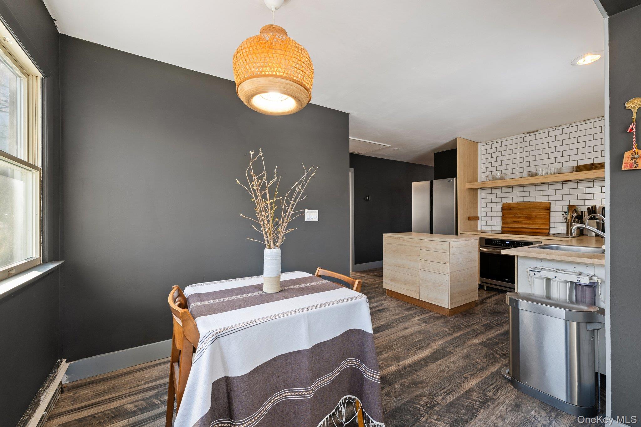 176 Maple Avenue South Flanders, NY 11901 - Photo 10 of 40 a kitchen with a table and chairs in it