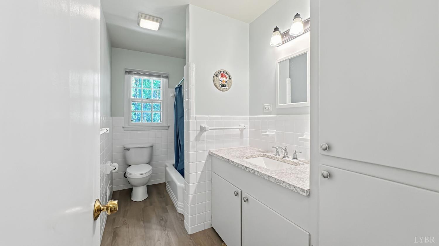 2044 Indian Hill Road Lynchburg, VA 24503 - Photo 20 of 30 a bathroom with a granite countertop sink toilet and a mirror