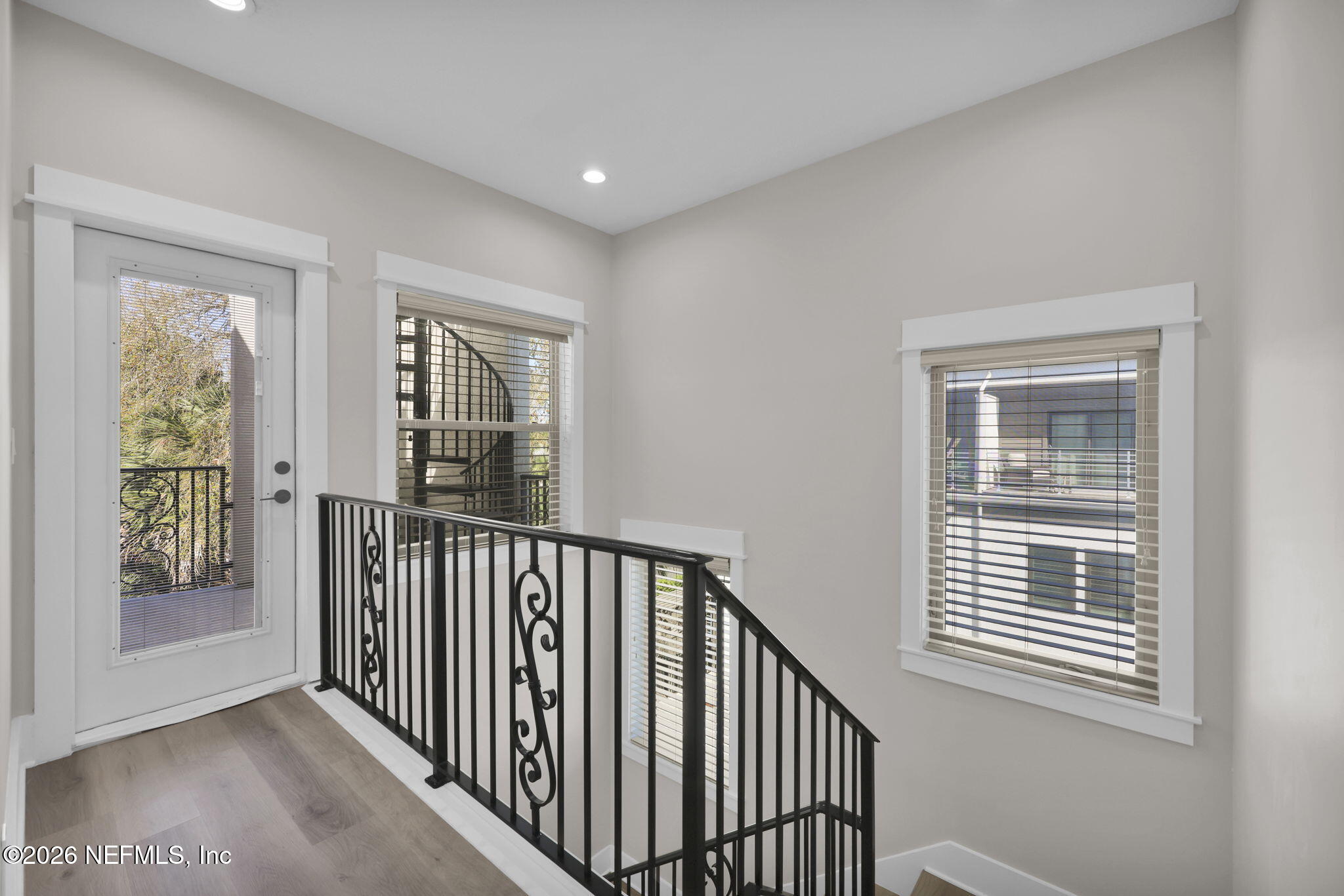 339 Ahern Street, Unit 4 Atlantic Beach, FL 32233 - Photo 22 of 47 a view of a hallway with windows
