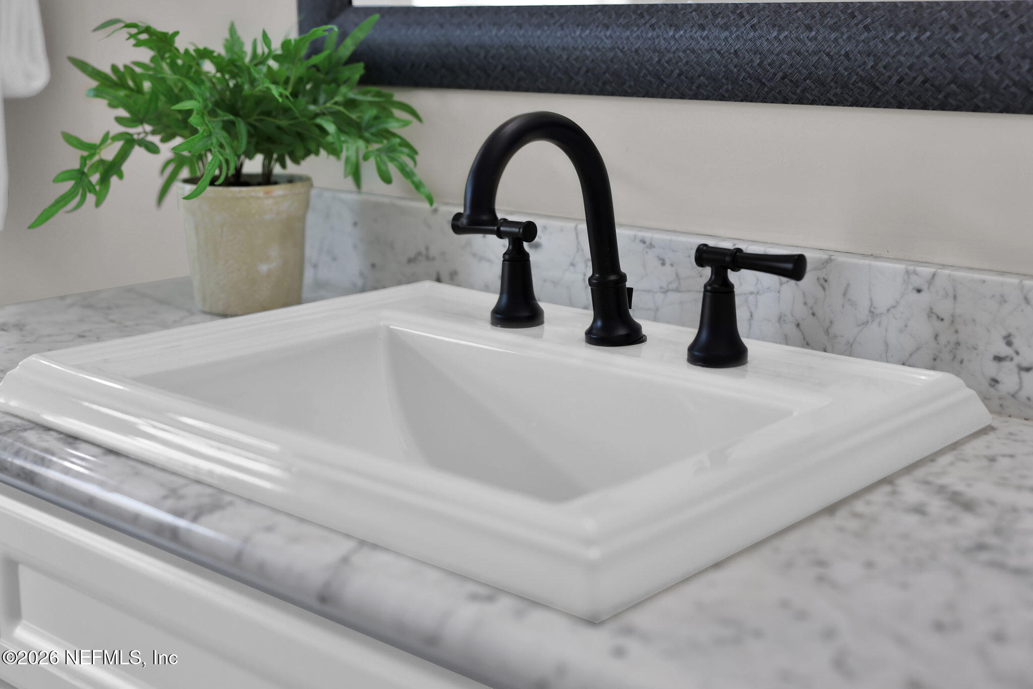 339 Ahern Street, Unit 4 Atlantic Beach, FL 32233 - Photo 25 of 47 a close view of sink and tap