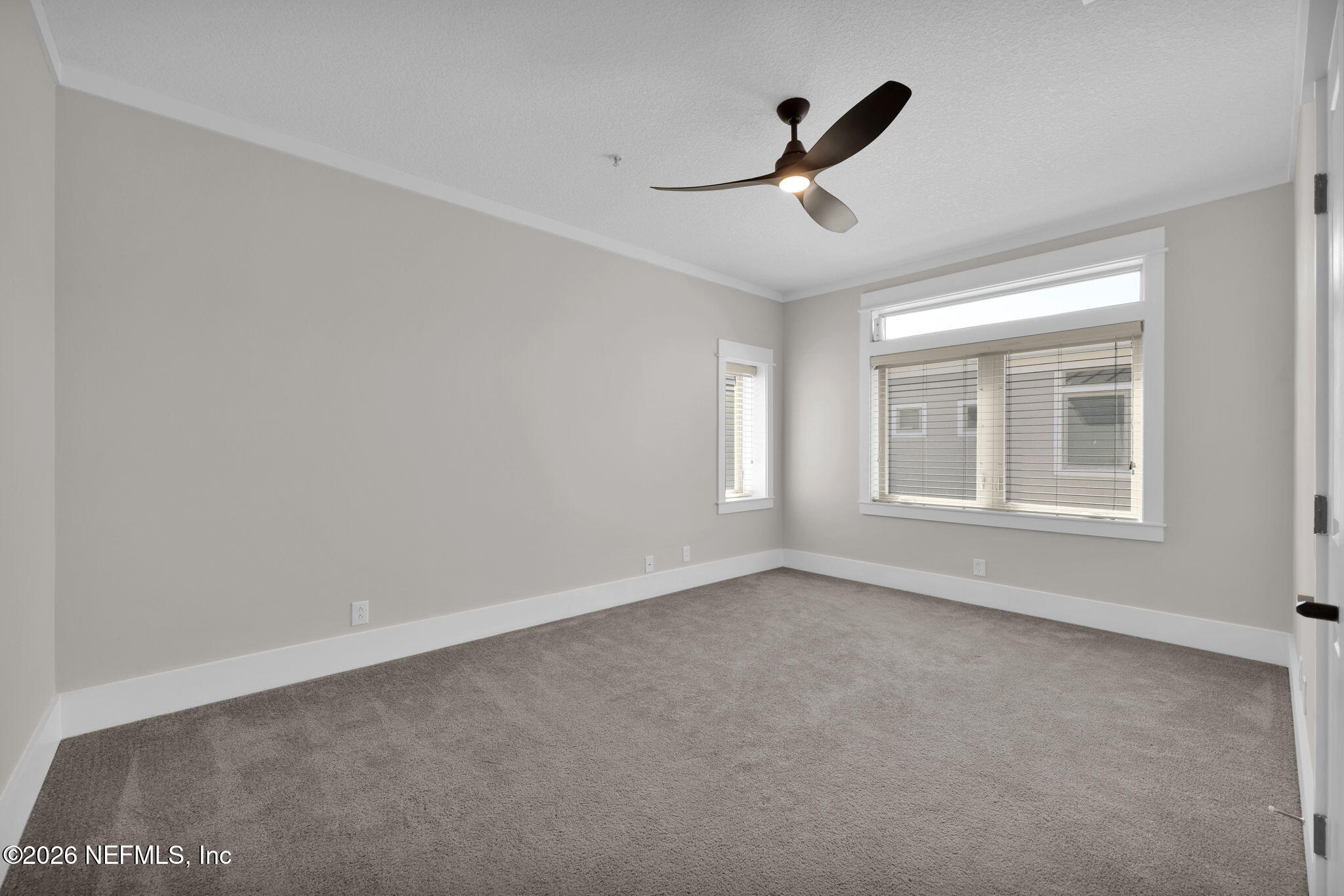 339 Ahern Street, Unit 4 Atlantic Beach, FL 32233 - Photo 26 of 47 a view of empty room with ceiling fan