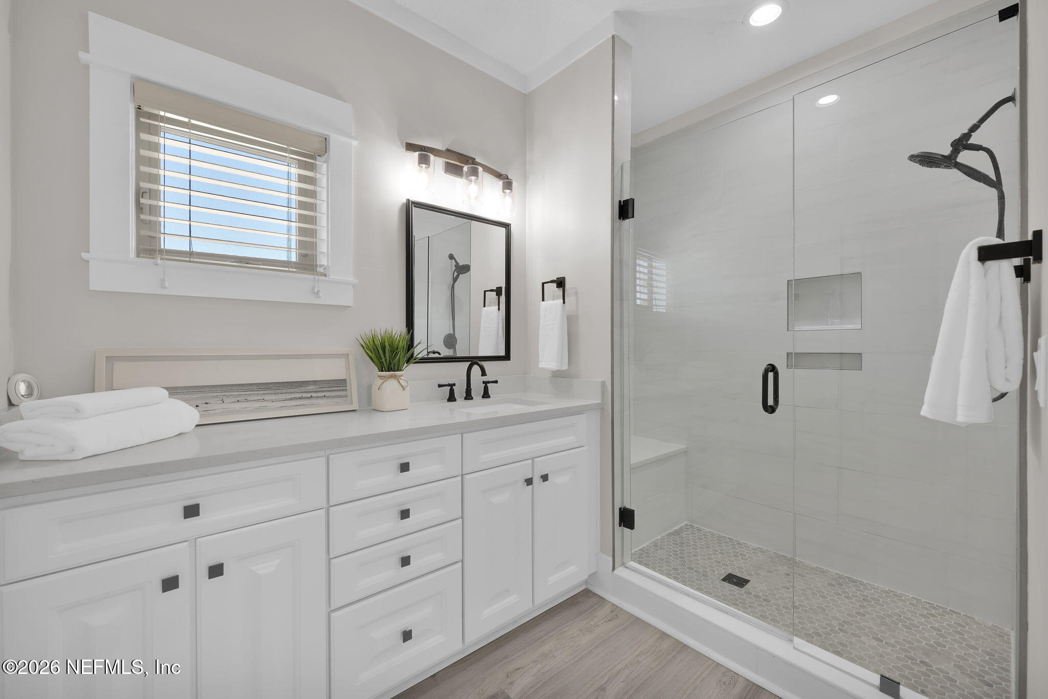 339 Ahern Street, Unit 4 Atlantic Beach, FL 32233 - Photo 27 of 47 a bathroom with a granite countertop sink a mirror a shower and a bathtub