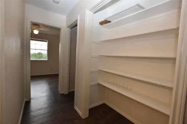 a view of an empty walk in closet