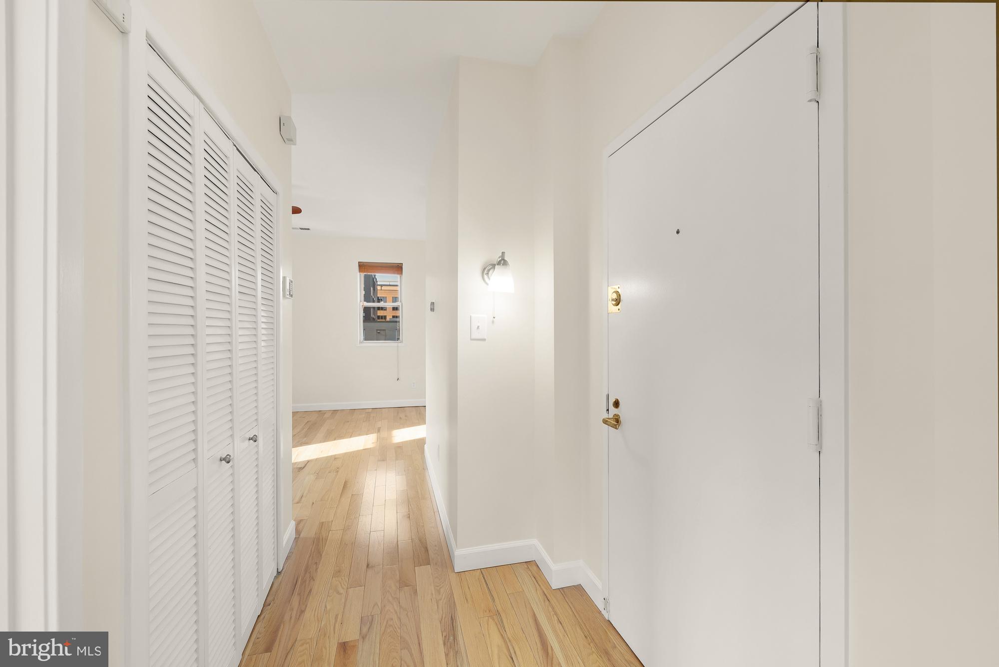 2114 N Street Northwest, Unit 47 Washington, DC 20037 - Photo 18 of 28 a view of a hallway with wooden floor