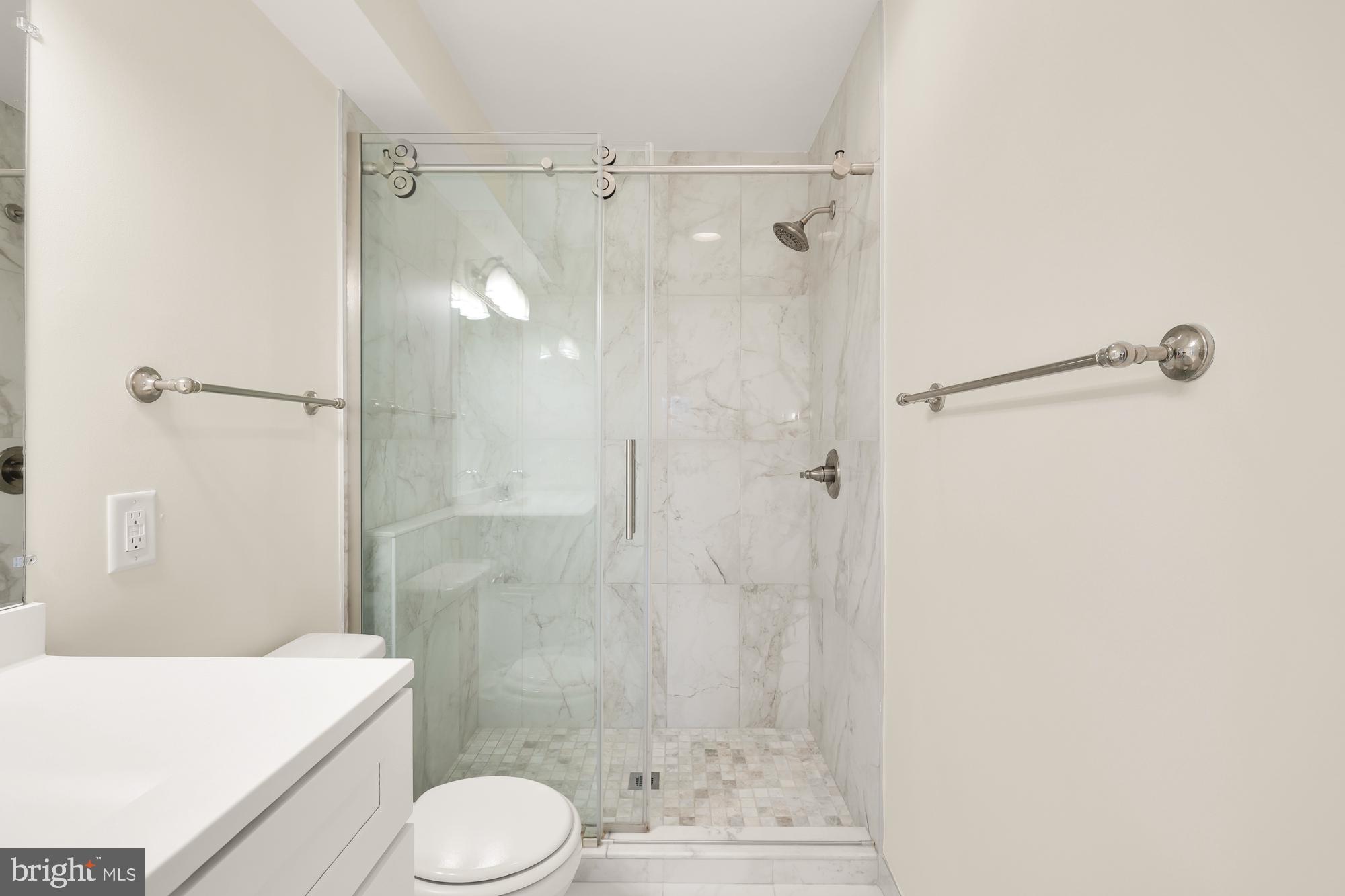 2114 N Street Northwest, Unit 47 Washington, DC 20037 - Photo 24 of 28 a bathroom with a shower and a toilet