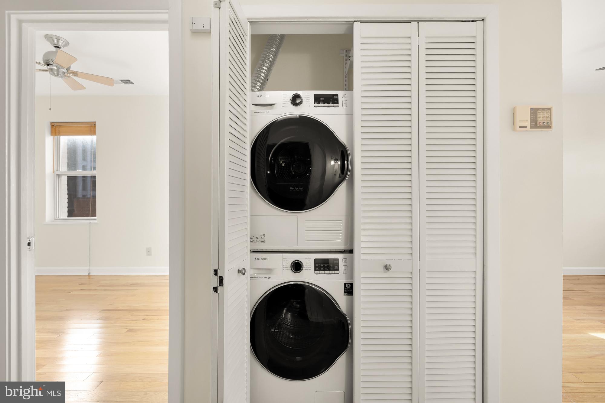 2114 N Street Northwest, Unit 47 Washington, DC 20037 - Photo 25 of 28 a utility room with dryer and washer