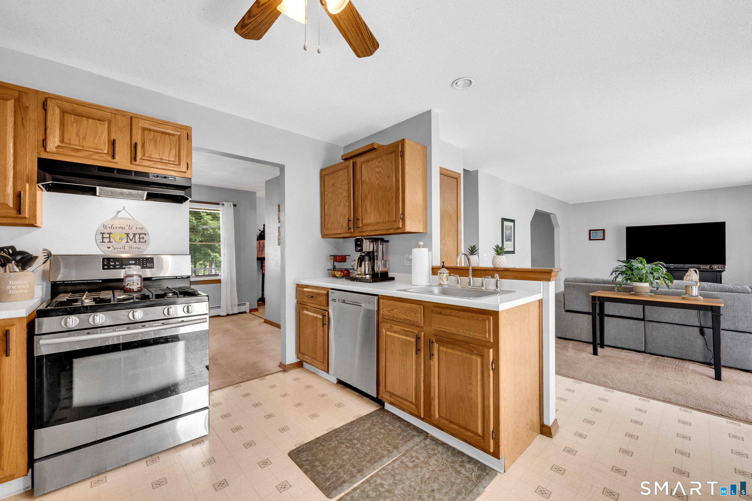 89 Windsorville Road South Windsor, CT 06074 - Photo 2 of 23 a kitchen with a stove a sink and a microwave