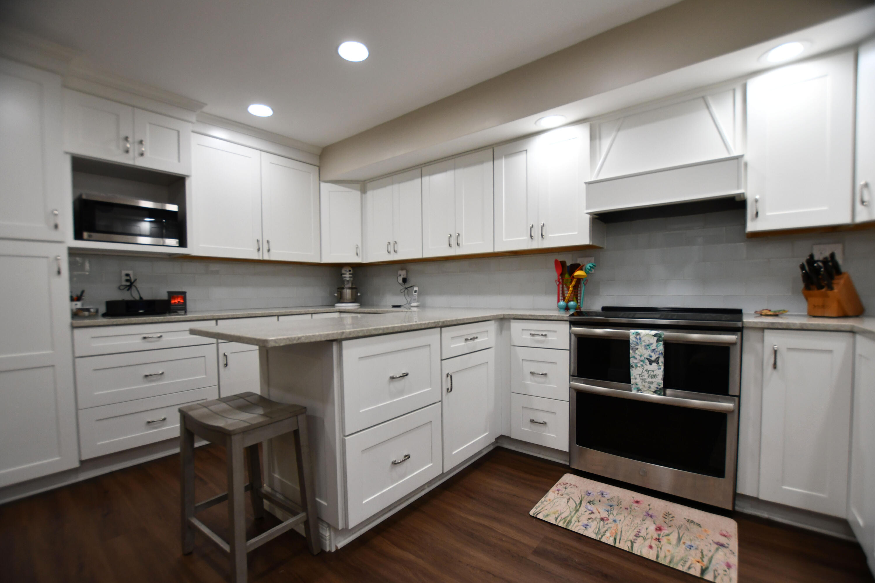 820 Sweet Lick Road Ravenna, KY 40472 - Photo 34 of 73 Stunning modern kitchen with crisp white cabinetry, center island, and sleek stainless-steel appliances!