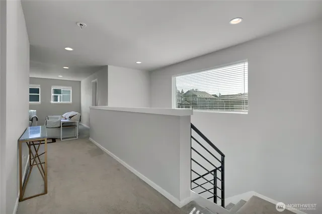 a view of a livingroom with furniture and staircase