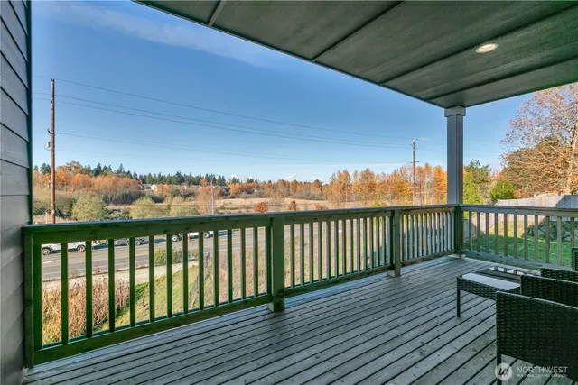 a view of roof deck with furniture