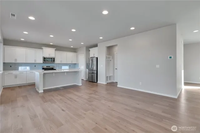 a view of kitchen with wooden floor