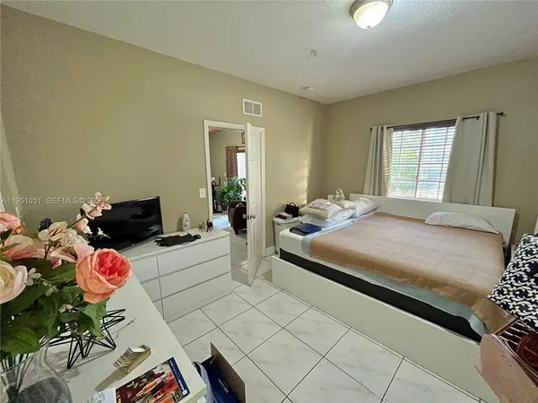 a bedroom with a bed and furniture