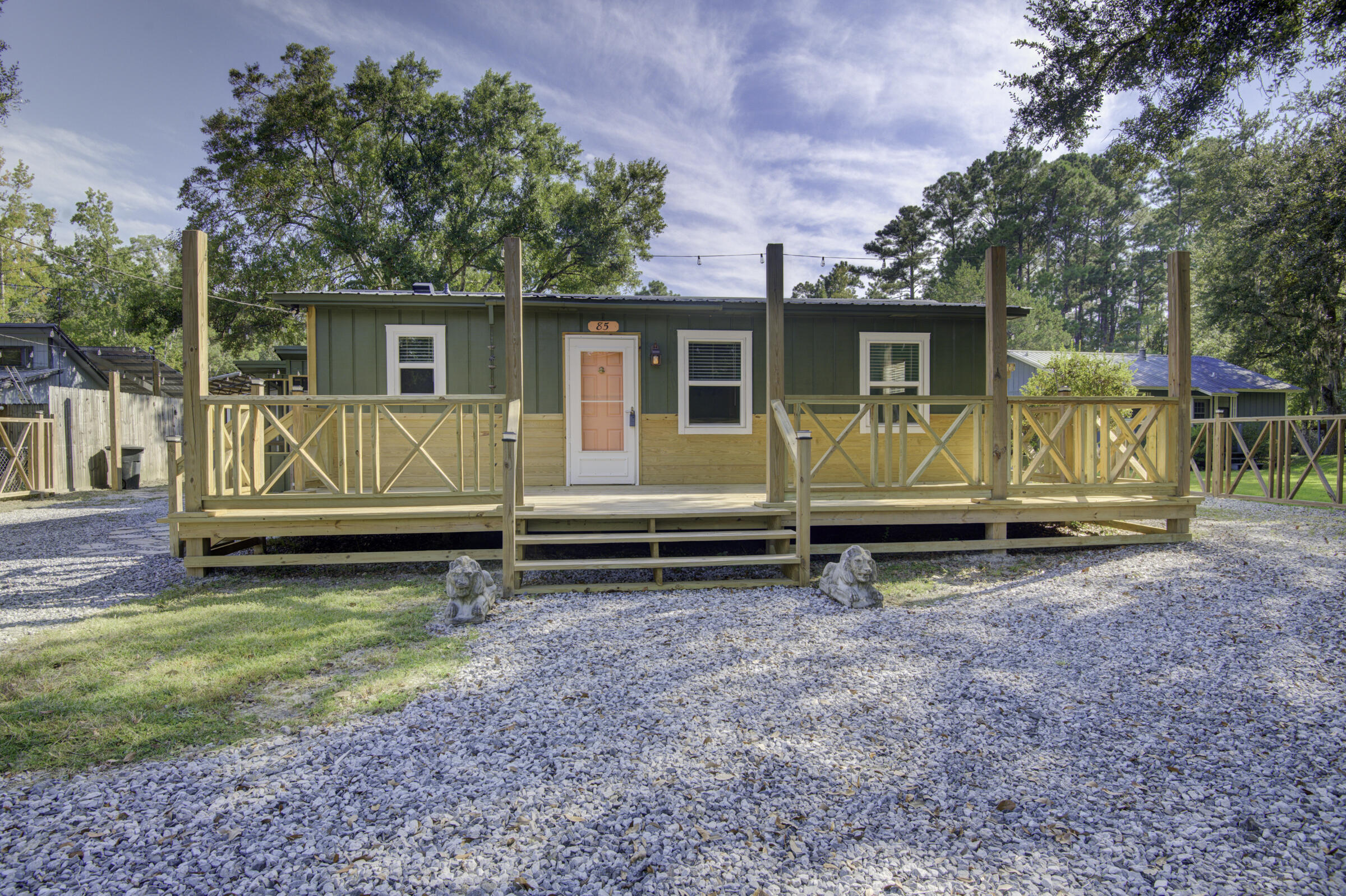 85 Our Street Vernon, FL 32462 - Photo 1 of 66 a view of backyard with wooden fence and a large tree