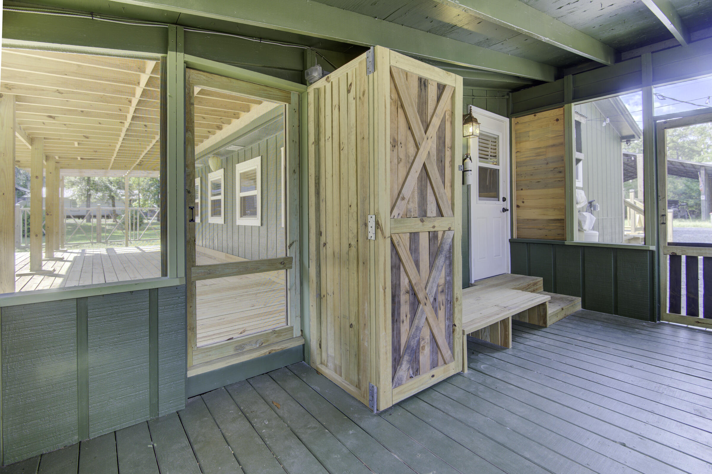 85 Our Street Vernon, FL 32462 - Photo 17 of 66 a view of an entryway with wooden floor and windows