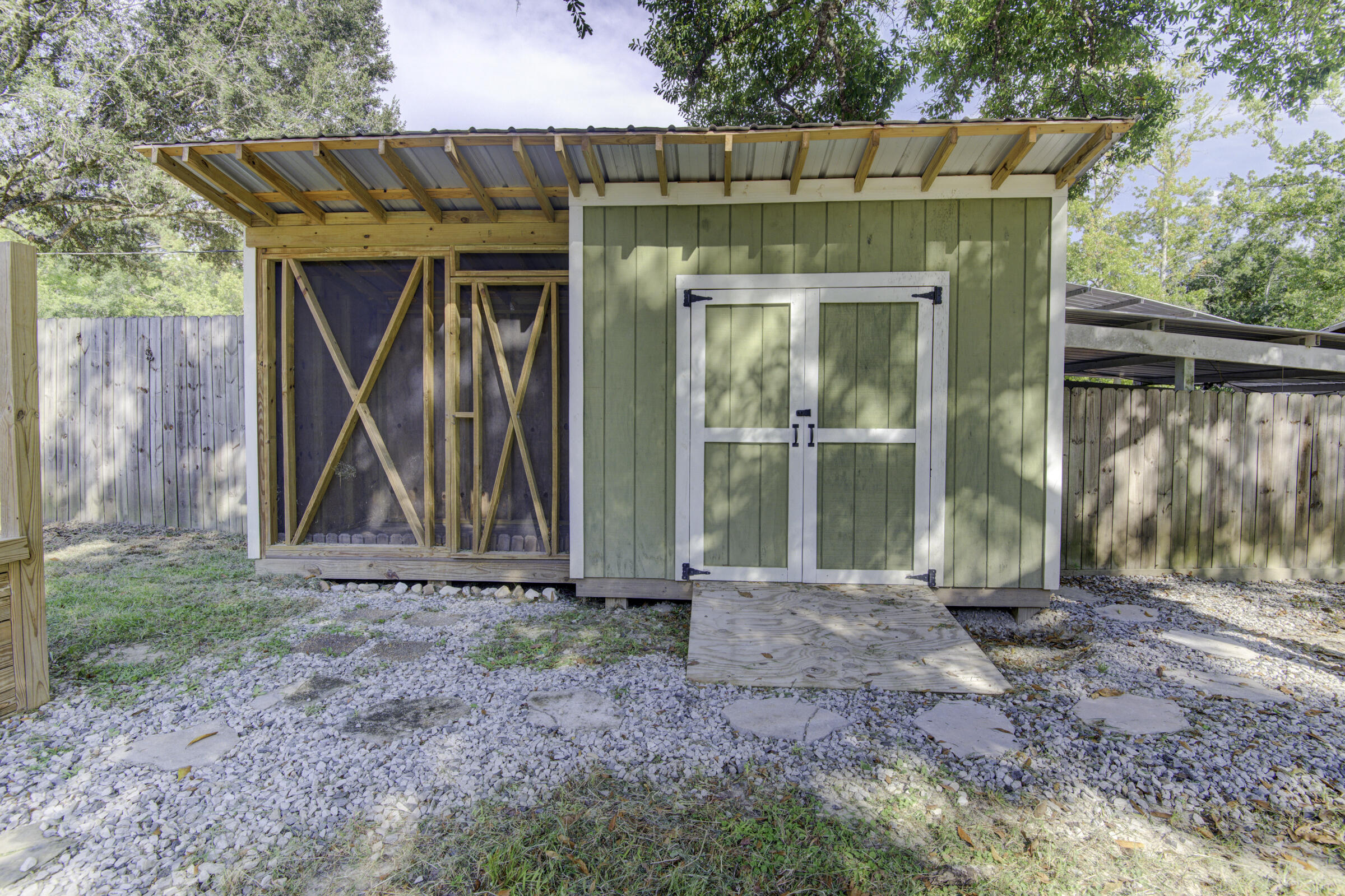 85 Our Street Vernon, FL 32462 - Photo 27 of 66 a front view of a house with shower